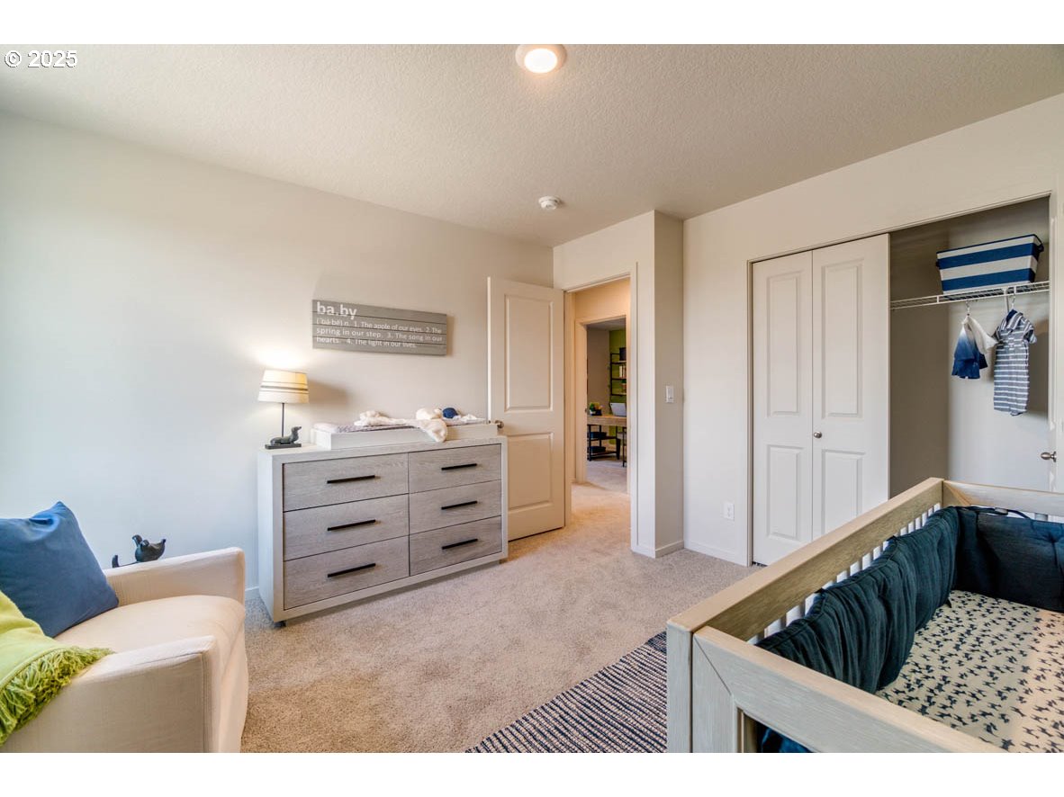 2996 U Street Springfield, OR 97477 - Photo 11 of 21 a bedroom with furniture and walk in closet