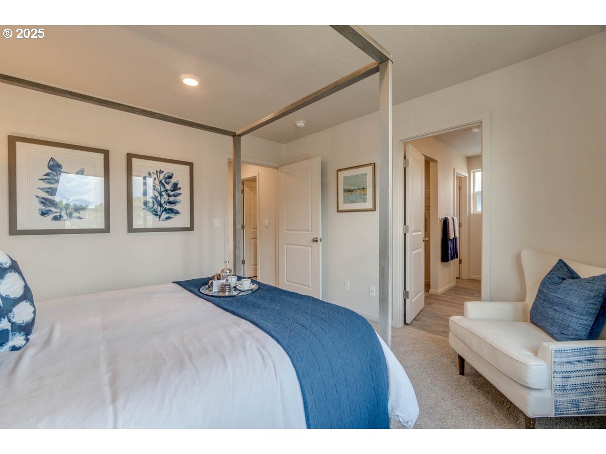 2996 U Street Springfield, OR 97477 - Photo 17 of 21 a bedroom with a large bed and a couch