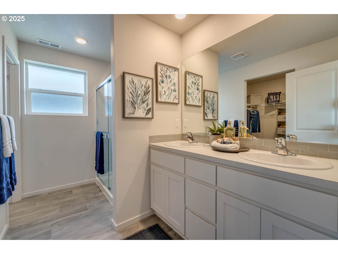 2996 U Street Springfield, OR 97477 - Photo 18 of 21 a bathroom with a double vanity sink and a mirror