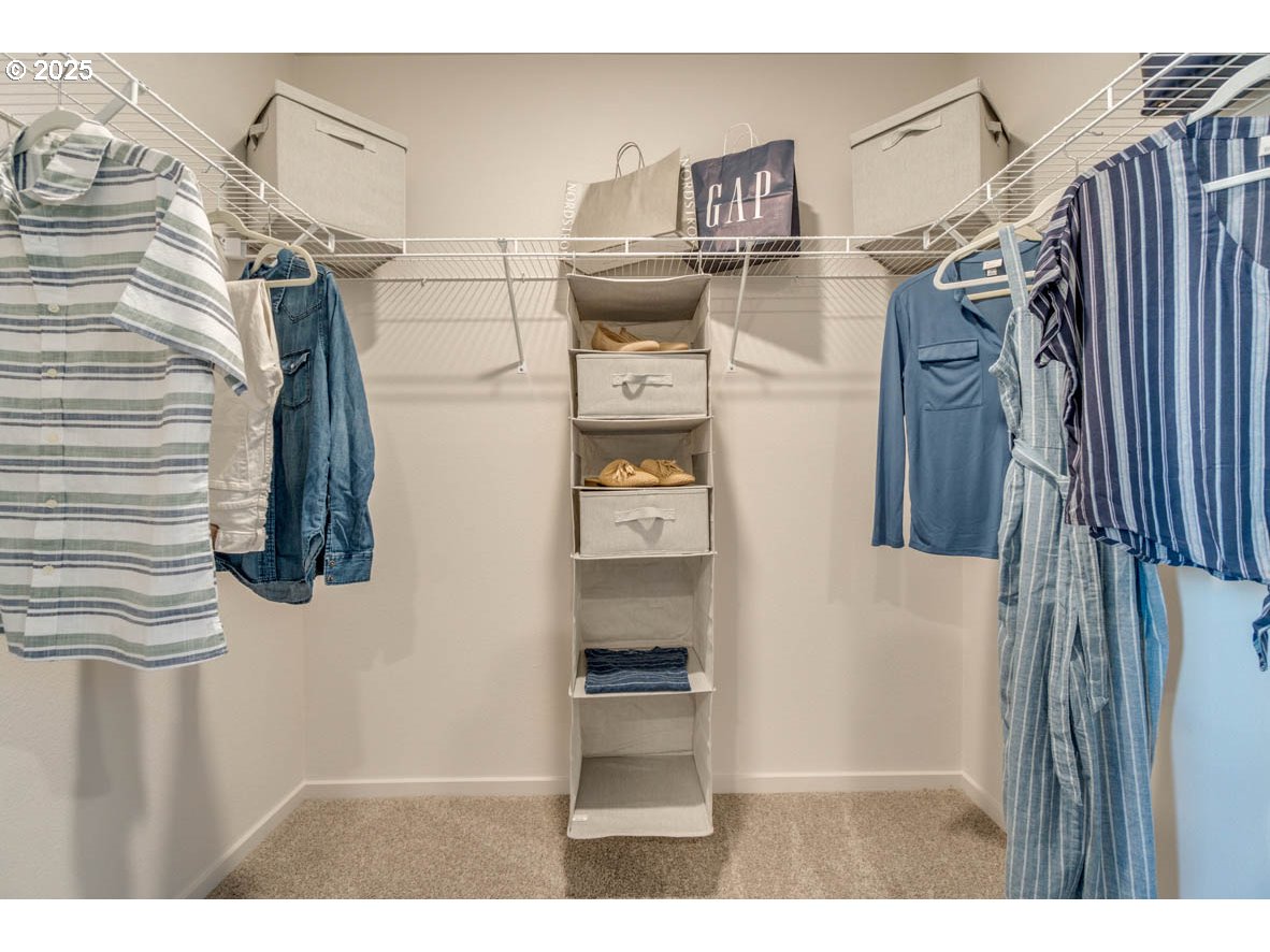 2996 U Street Springfield, OR 97477 - Photo 19 of 21 a view of walk in closet with clothes and shoes