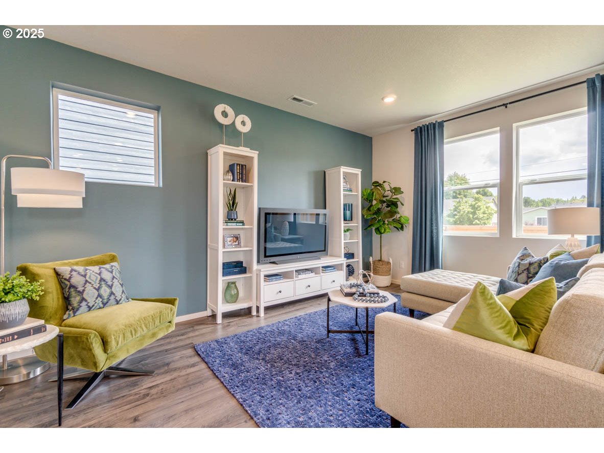 2996 U Street Springfield, OR 97477 - Photo 5 of 21 a living room with furniture and a flat screen tv