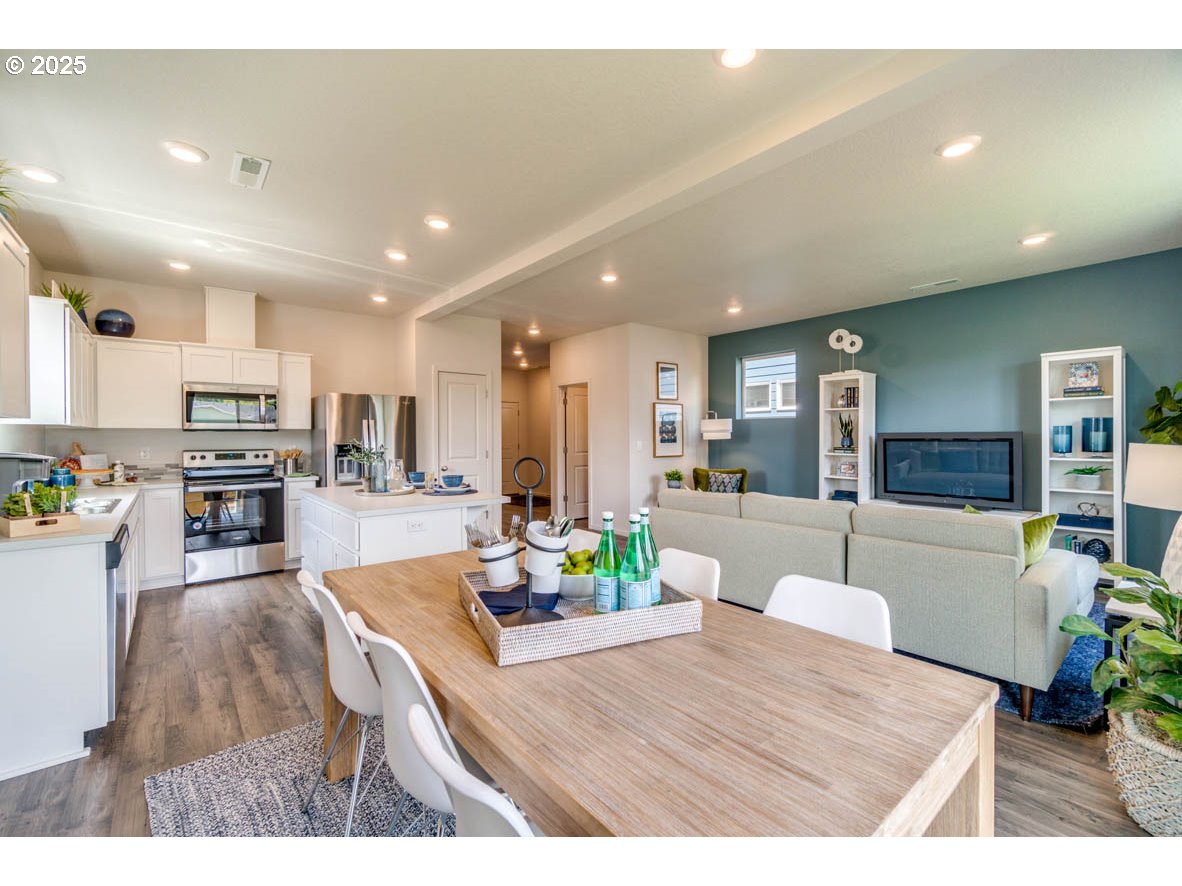 2996 U Street Springfield, OR 97477 - Photo 9 of 21 a living room with stainless steel appliances kitchen island furniture and a view of kitchen