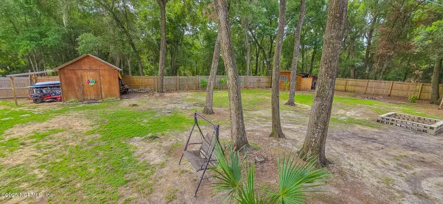 a view of a backyard with garden