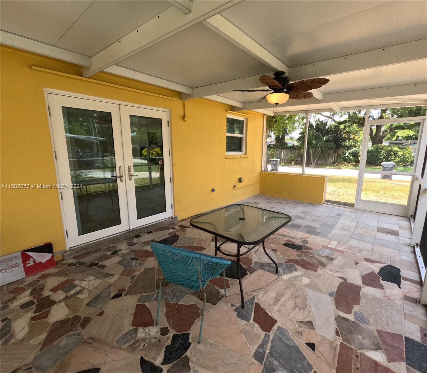 6170 Harding Street, Unit F Hollywood, FL 33024 - Photo 11 of 17 a view of a porch with furniture and a yard