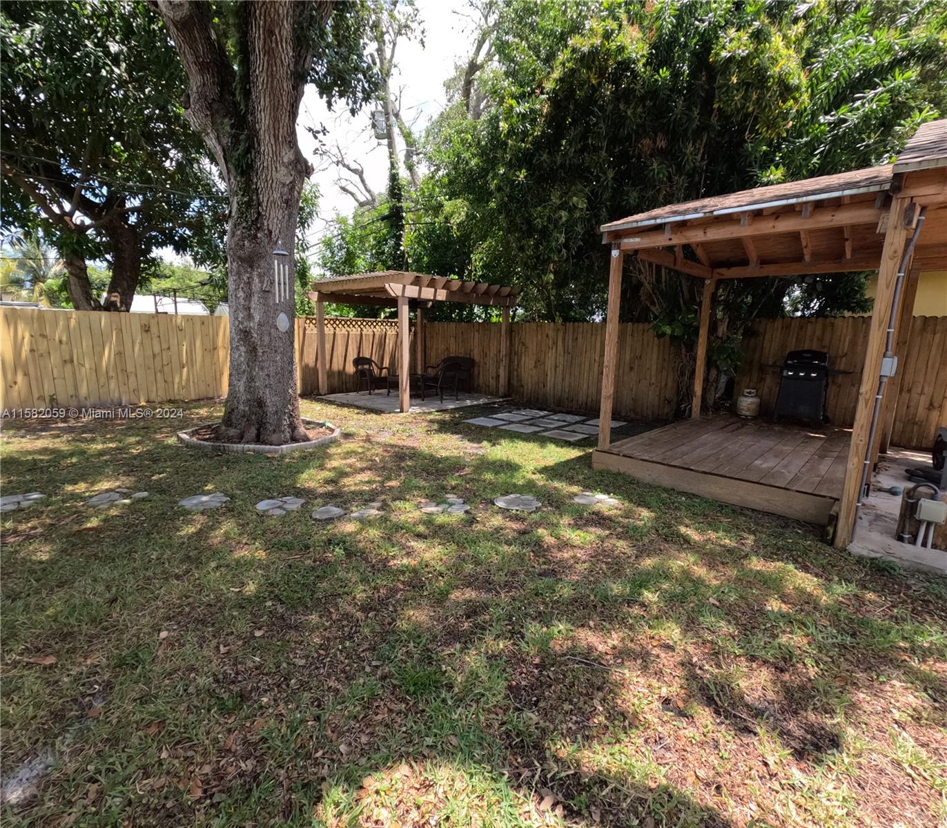 6170 Harding Street, Unit F Hollywood, FL 33024 - Photo 13 of 17 a view of a backyard