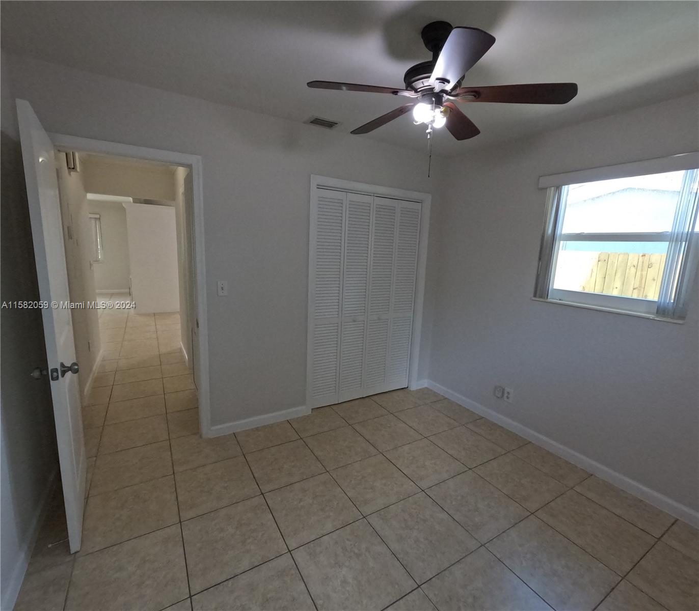 6170 Harding Street, Unit F Hollywood, FL 33024 - Photo 17 of 17 a view of an empty room with a window