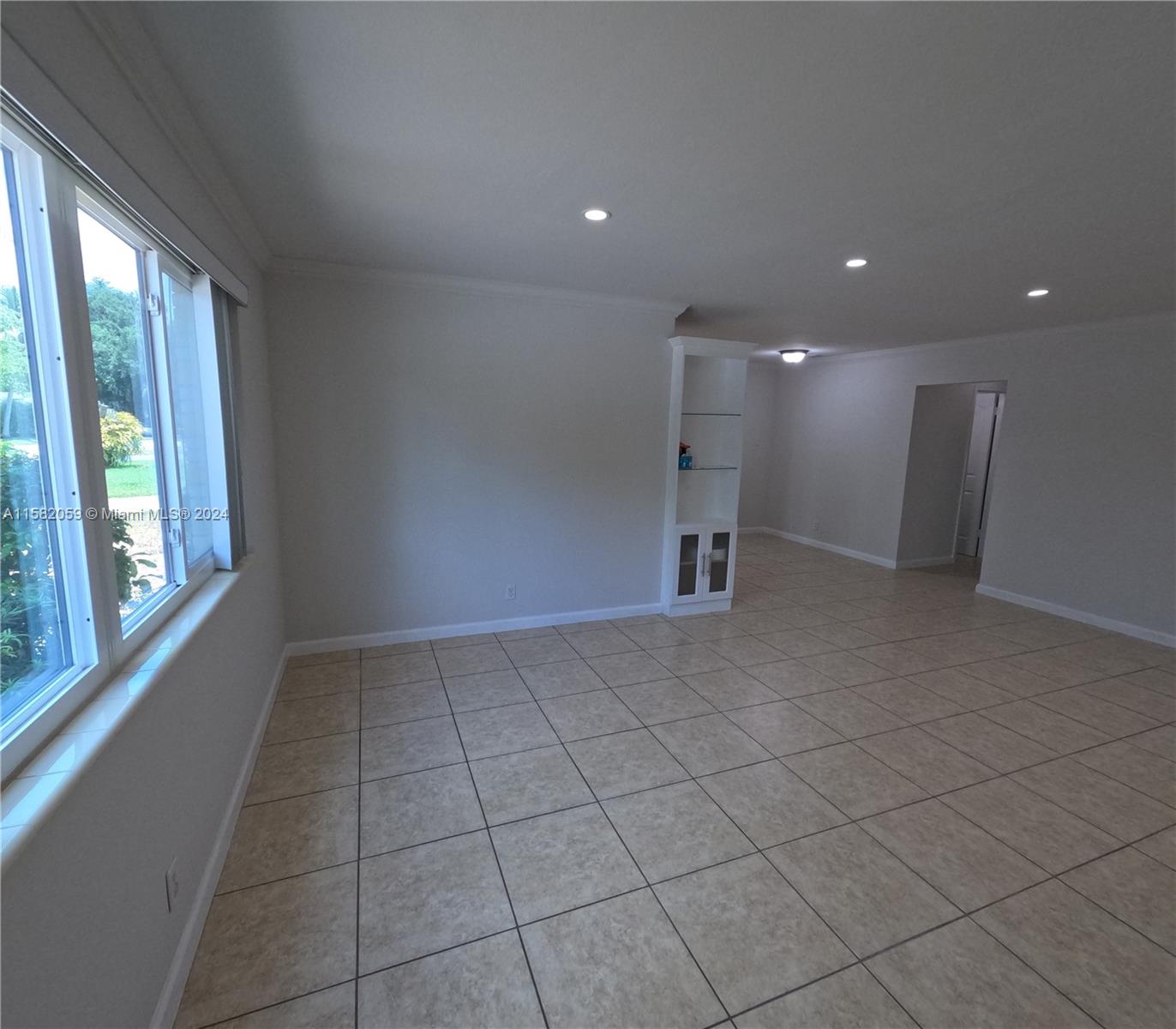 6170 Harding Street, Unit F Hollywood, FL 33024 - Photo 3 of 17 a view of an empty room with a window