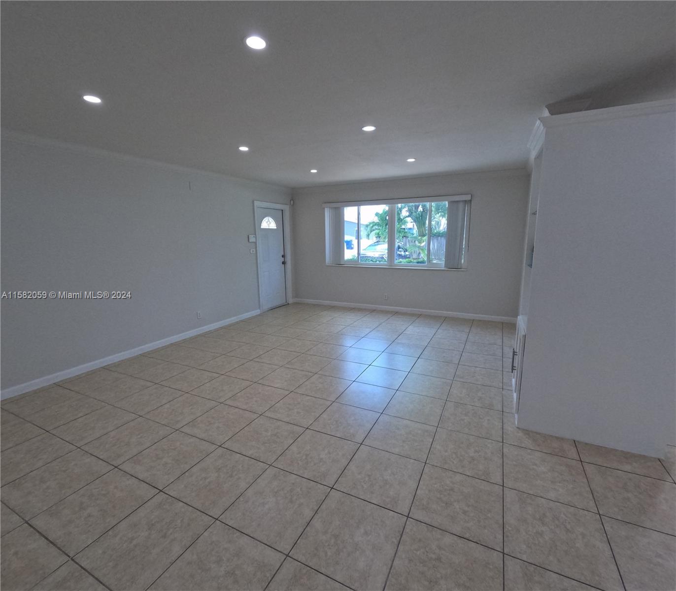 6170 Harding Street, Unit F Hollywood, FL 33024 - Photo 5 of 17 a view of an empty room and window
