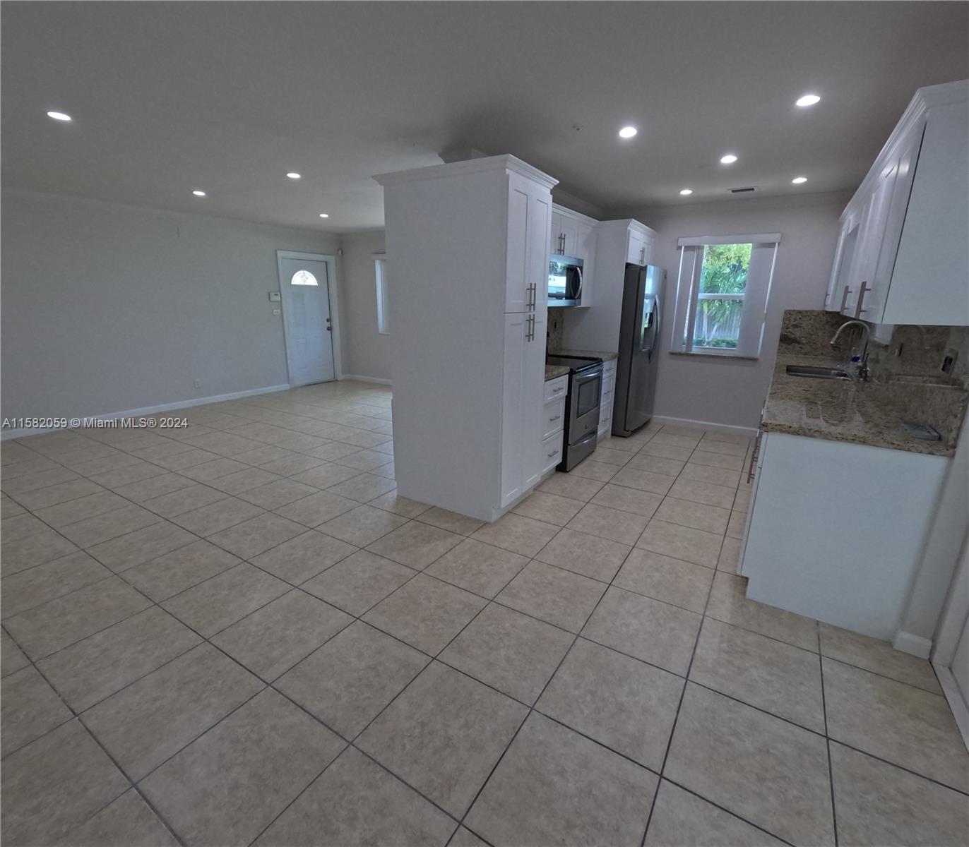 6170 Harding Street, Unit F Hollywood, FL 33024 - Photo 6 of 17 a view of a kitchen with a sink