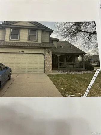 a front view of a house with garage