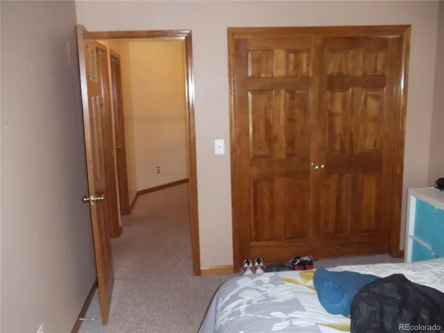 a bed room with a bed and a mirror