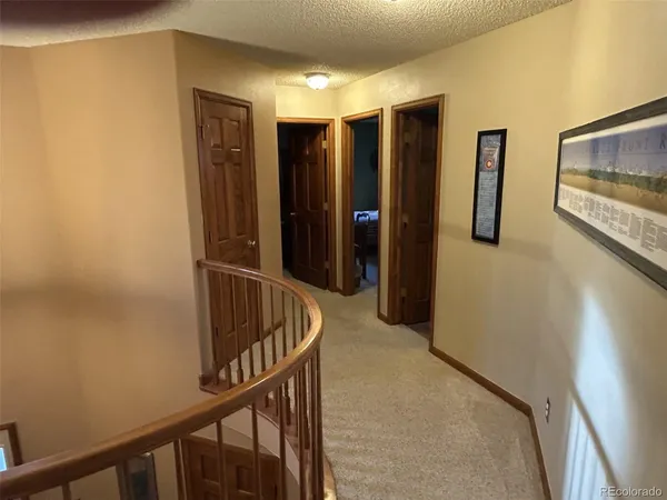 a bedroom with a bed wooden floor and a window