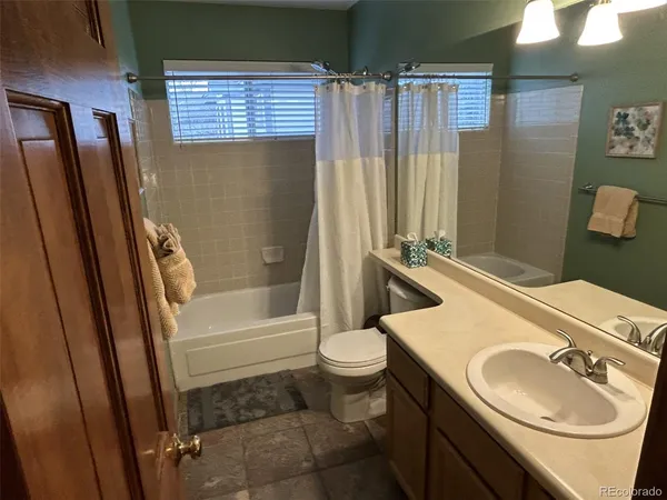 a view of a hallway with furniture