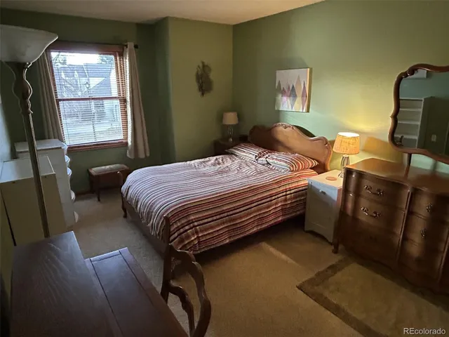 a view of a hallway with furniture