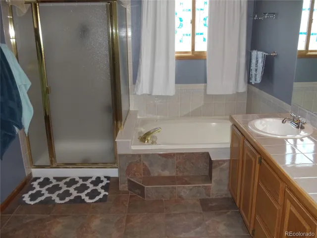 a bathroom with a bathtub and a sink