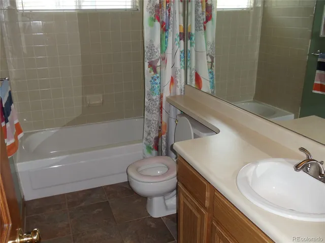 a bathroom with a sink a toilet and a bathtub
