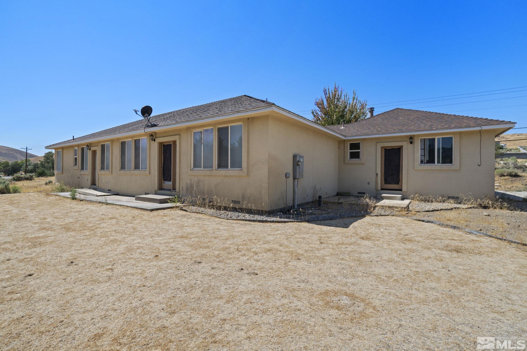 201 Rhodes Road Reno, NV 89521 - Photo 32 of 38 a front view of a house with a yard