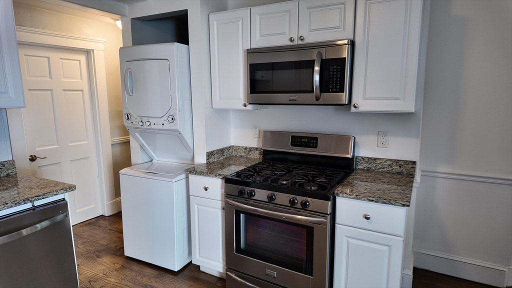 294 Windsor Street, Unit 2 Cambridge, MA 02139 - Photo 2 of 13 a kitchen with stainless steel appliances a stove microwave and sink