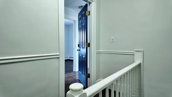 a view of balcony with wooden floor
