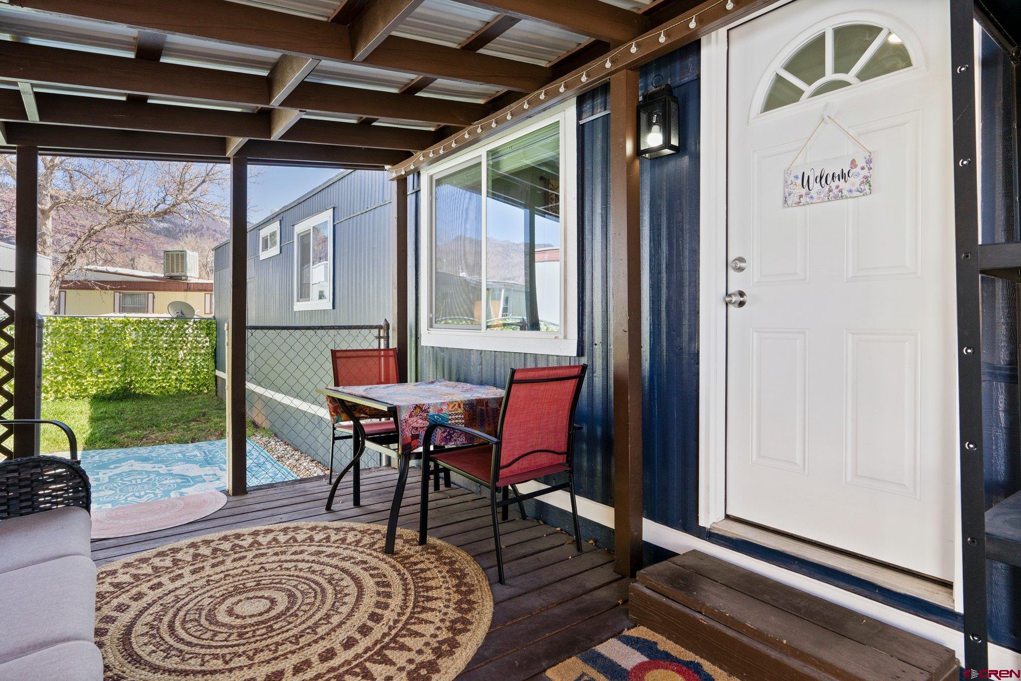 a view of a porch with furniture