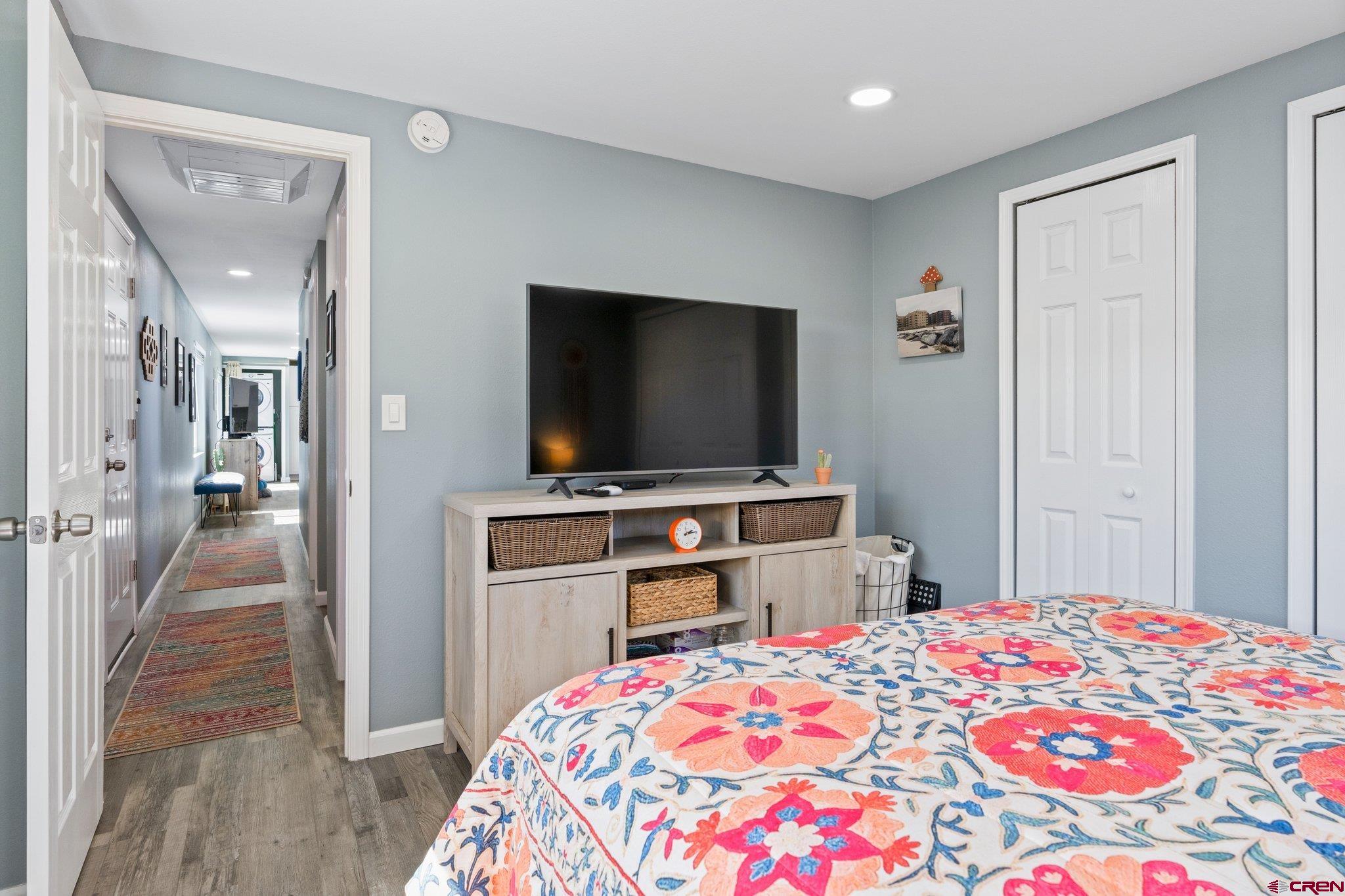 31722 Highway 550, Unit 55 Durango, CO 81301 - Photo 14 of 20 a bedroom with a bed and a flat screen tv