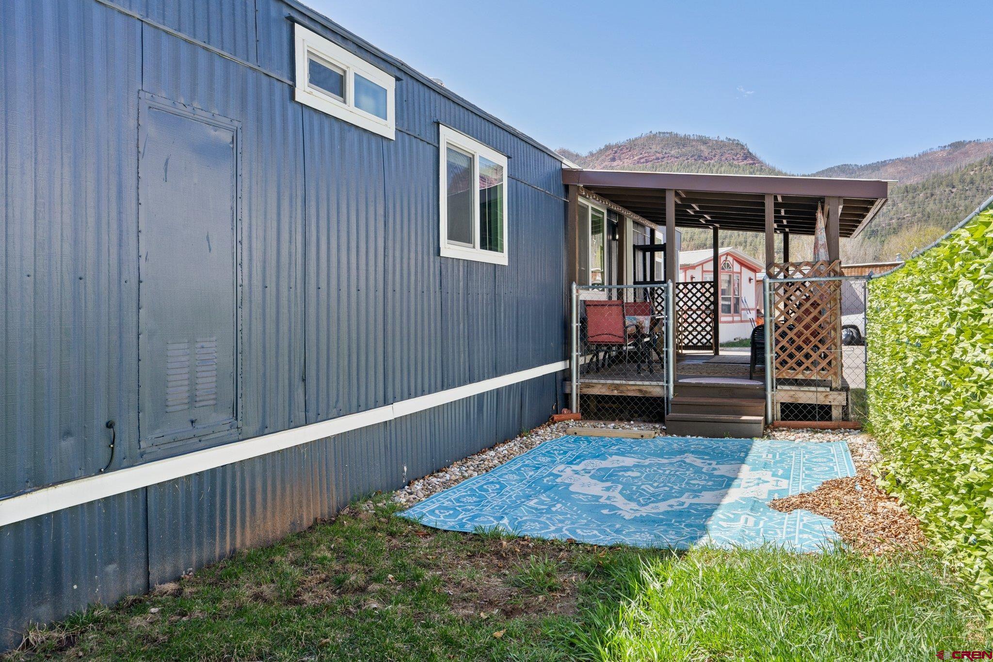 31722 Highway 550, Unit 55 Durango, CO 81301 - Photo 19 of 20 a front view of a house with porch