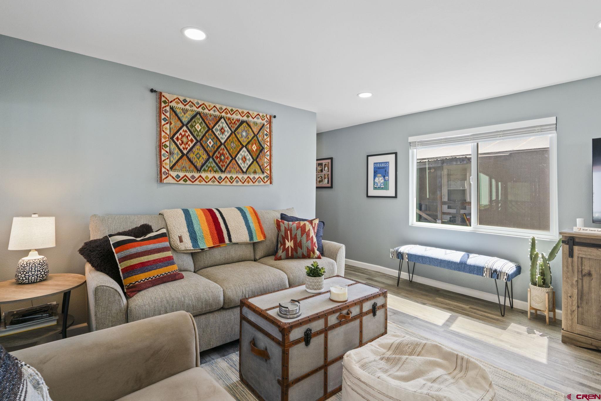 31722 Highway 550, Unit 55 Durango, CO 81301 - Photo 2 of 20 a living room with furniture and a large window