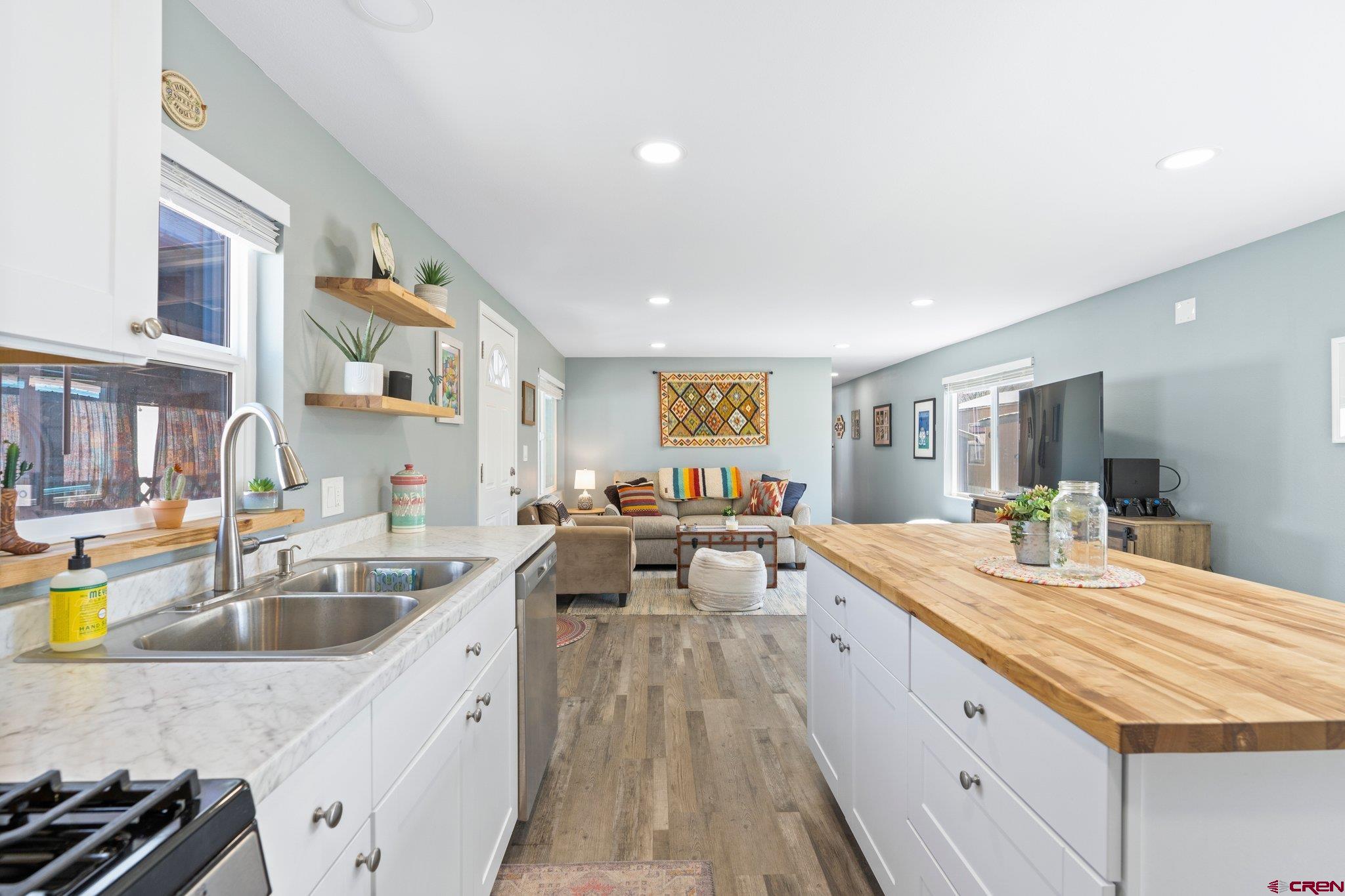 31722 Highway 550, Unit 55 Durango, CO 81301 - Photo 6 of 20 a large white kitchen with a large window