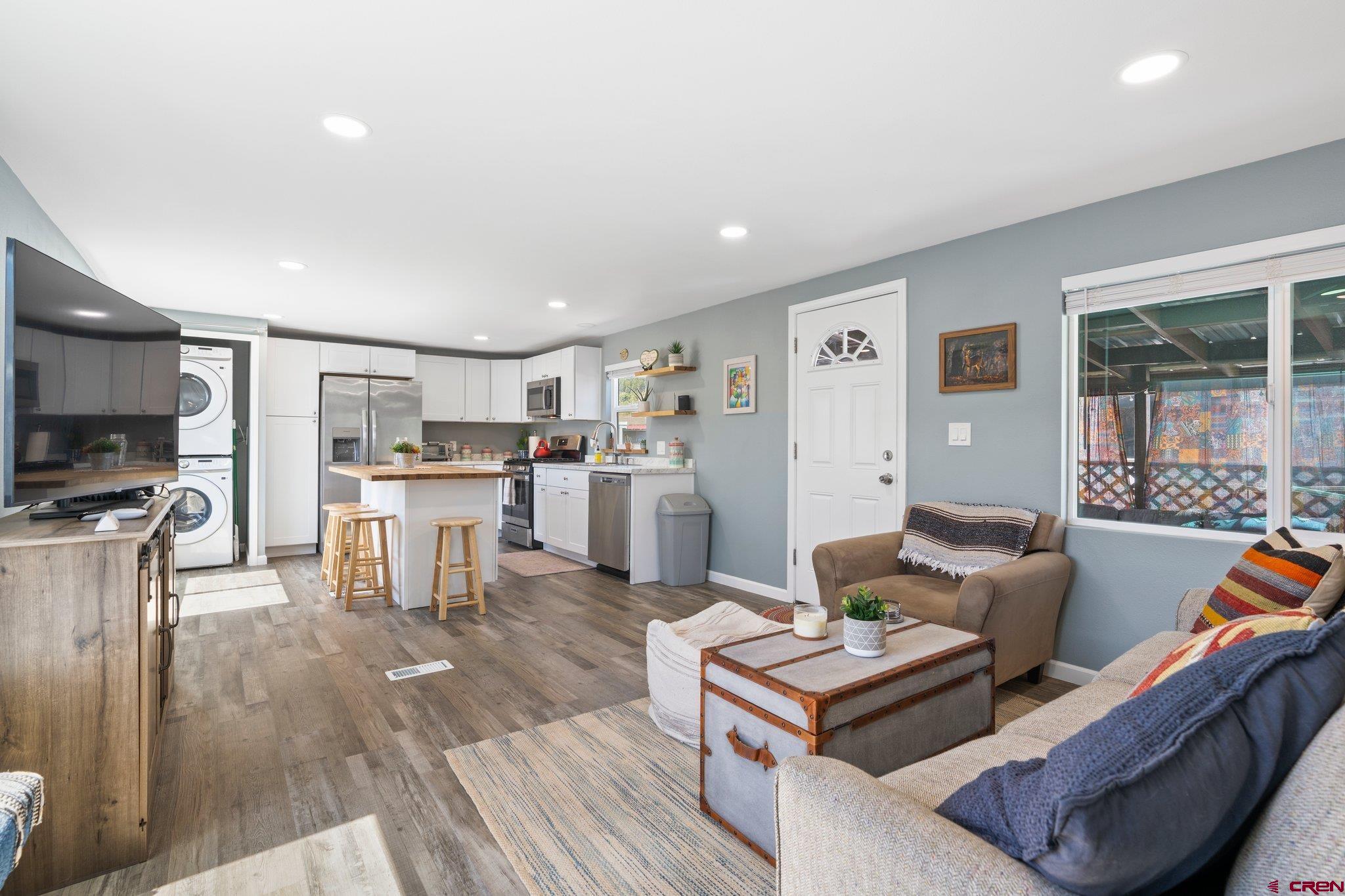 31722 Highway 550, Unit 55 Durango, CO 81301 - Photo 9 of 20 a living room with furniture and a kitchen view
