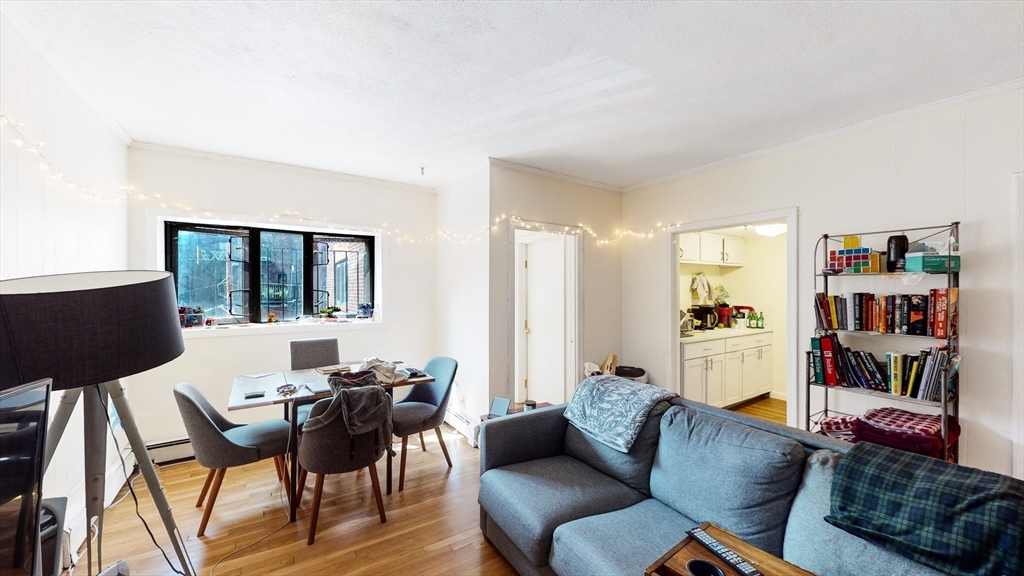513 Beacon Street, Unit 6 Boston, MA 02215 - Photo 2 of 8 a living room with furniture and a window