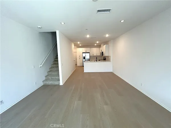 a view of a kitchen with a sink and cabinets