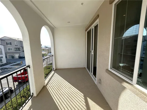a view of a two chairs in the balcony