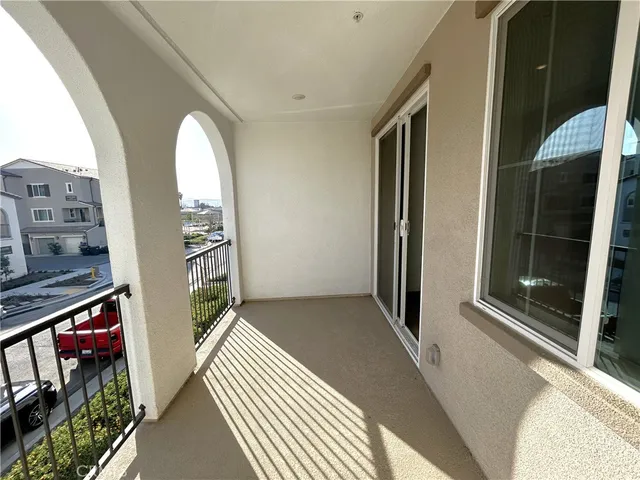 a view of a two chairs in the balcony