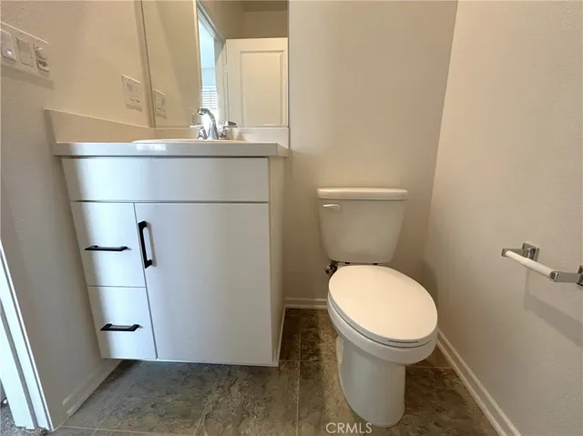 a view of an empty room and a window