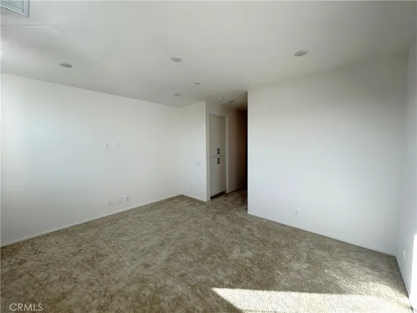 a bathroom with a double vanity sink a toilet and a mirror