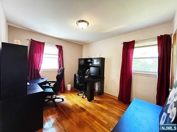 a bedroom with furniture and window