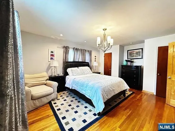 a spacious bedroom with a bed and a couch