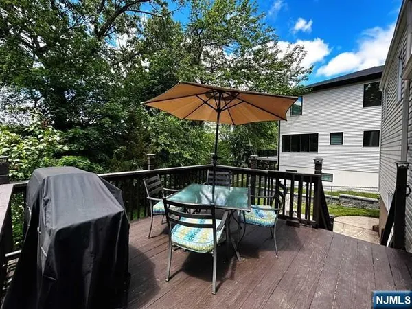 a view of backyard with a patio