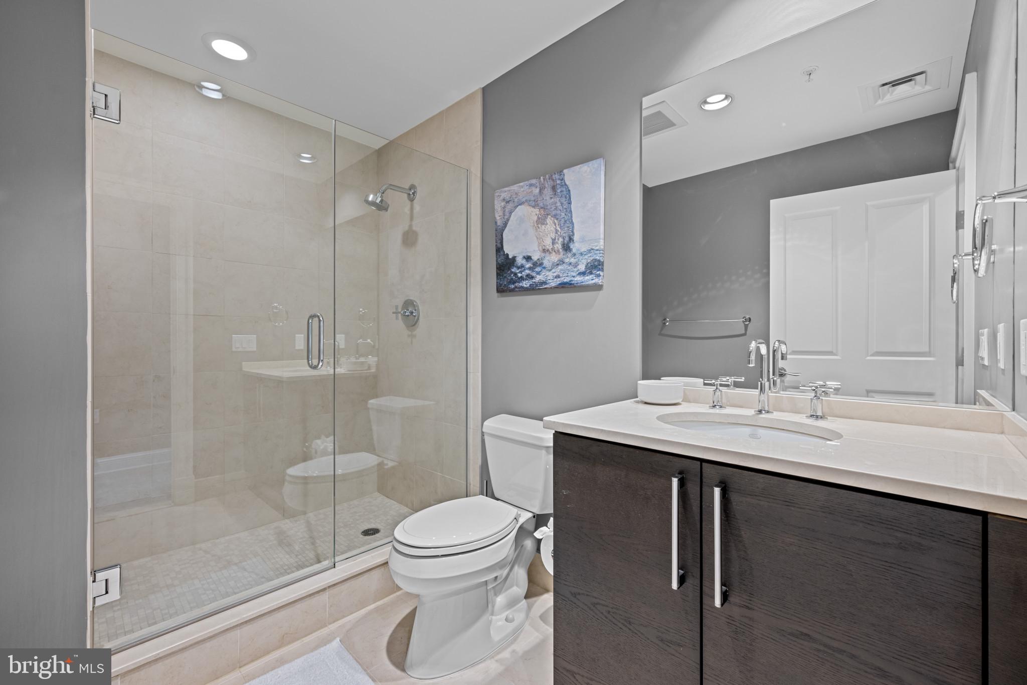 801 Key Highway, Unit 458 Baltimore, MD 21230 - Photo 32 of 48 a bathroom with a sink a toilet and shower