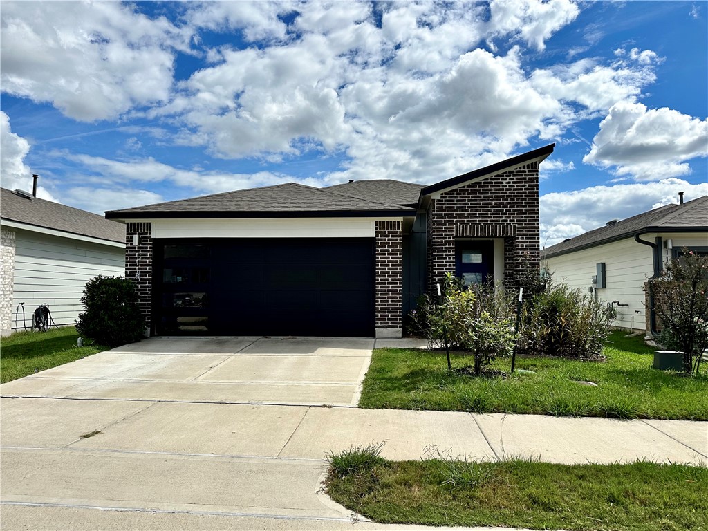 1118 Amistad Loop College Station, TX 77845 - Photo 1 of 26 a front view of house with yard