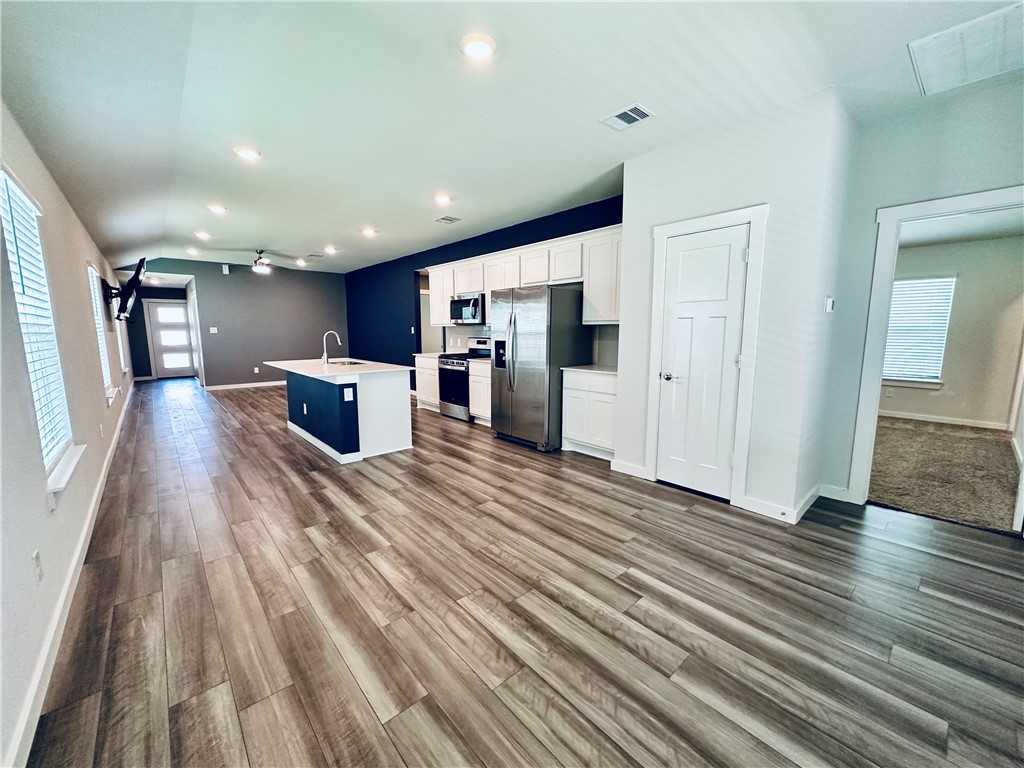 1118 Amistad Loop College Station, TX 77845 - Photo 10 of 26 a view of a livingroom with a furniture wooden floor and windows