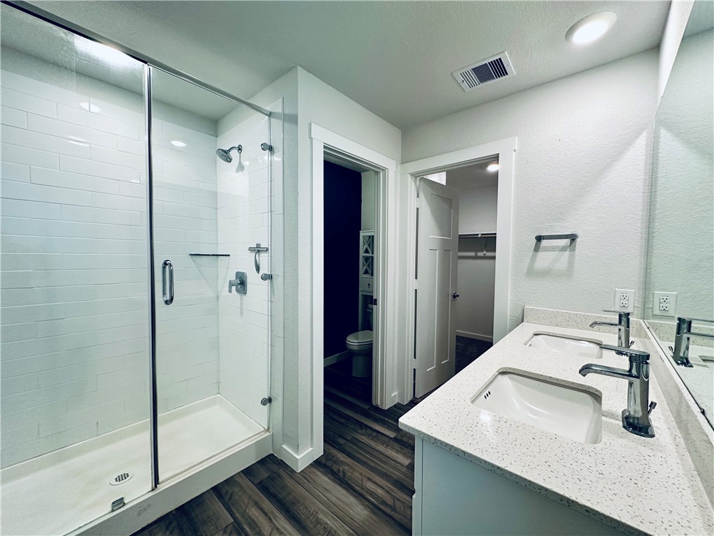 1118 Amistad Loop College Station, TX 77845 - Photo 13 of 26 a bathroom with a sink shower and a mirror