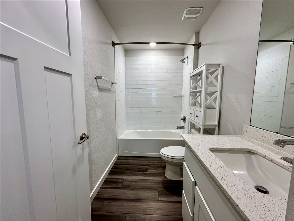 1118 Amistad Loop College Station, TX 77845 - Photo 17 of 26 a bathroom with a sink a toilet and shower