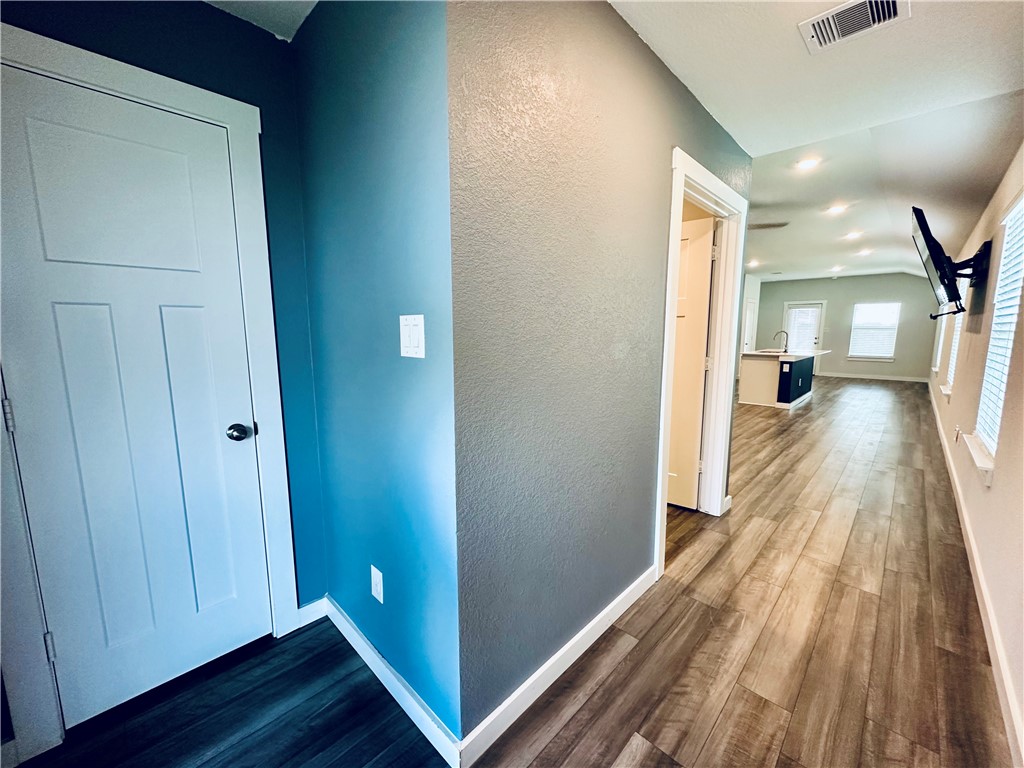 1118 Amistad Loop College Station, TX 77845 - Photo 2 of 26 a view of a hallway with wooden floor