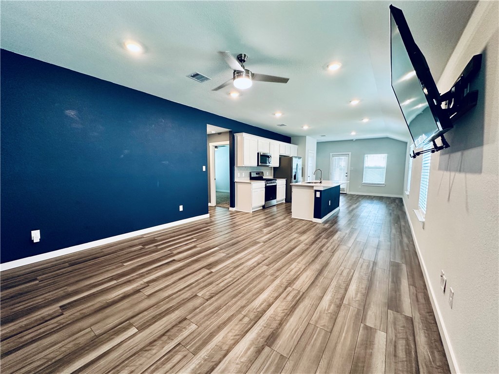 1118 Amistad Loop College Station, TX 77845 - Photo 24 of 26 a view of livingroom with hardwood floor and a ceiling fan