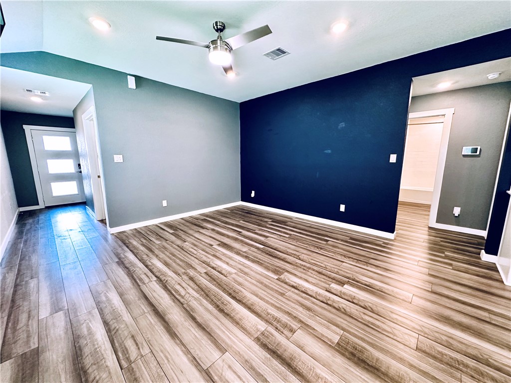 1118 Amistad Loop College Station, TX 77845 - Photo 4 of 26 a view of a livingroom with wooden floor