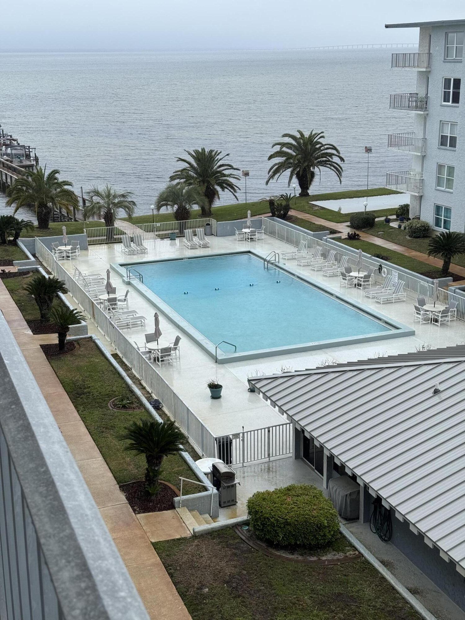 a view of a swimming pool with a lounge chairs