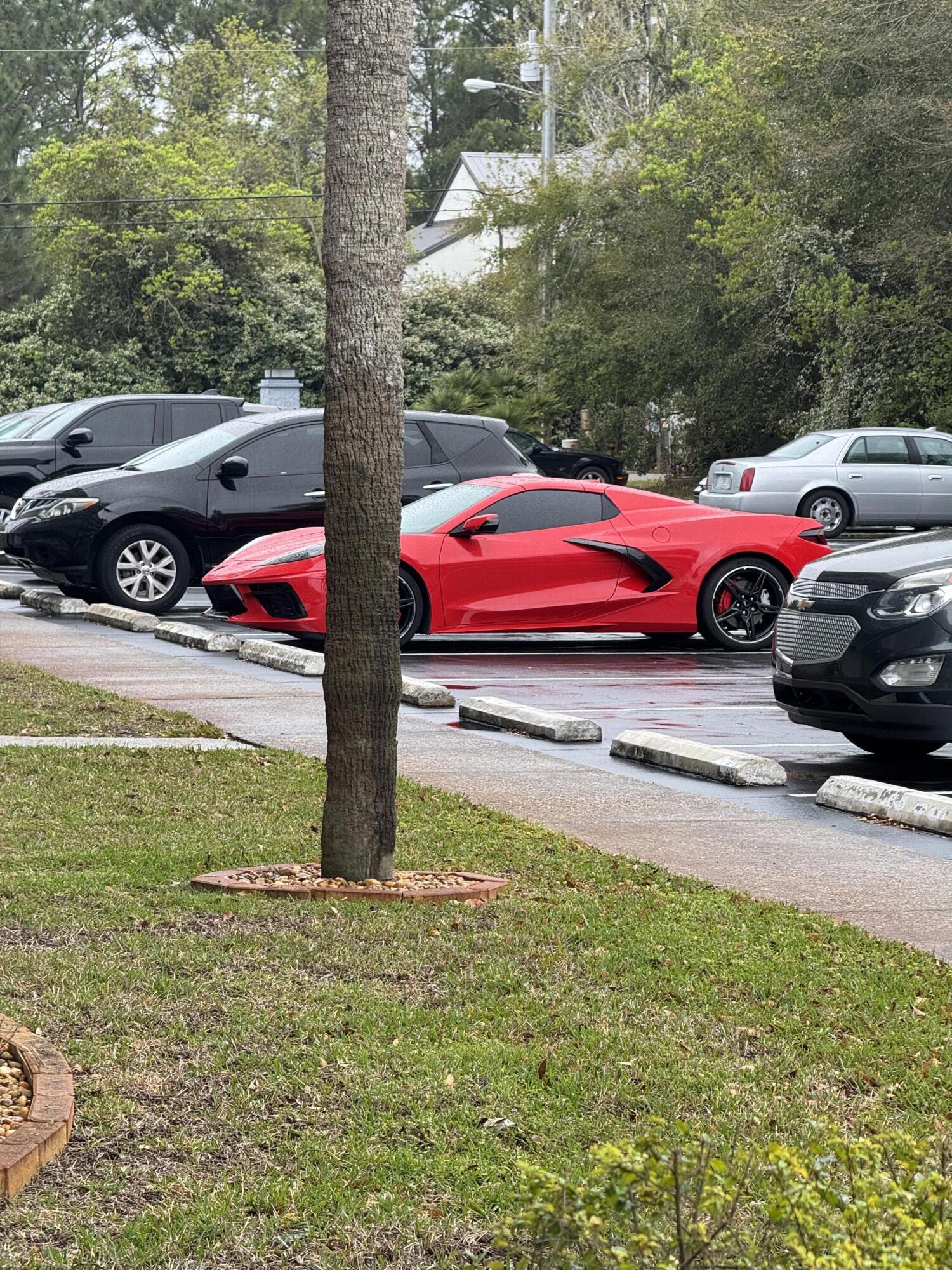 3857 Indian Trail, Unit 507 Destin, FL 32541 - Photo 26 of 33 a car parked in the middle of a road
