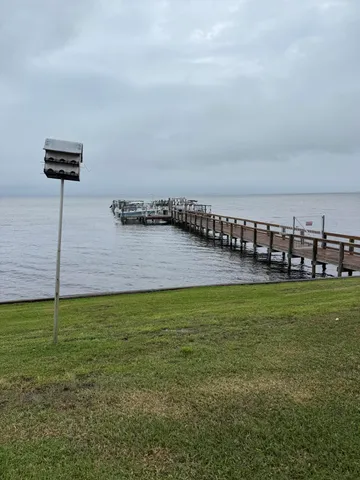 a view of a swimming pool and an chairs