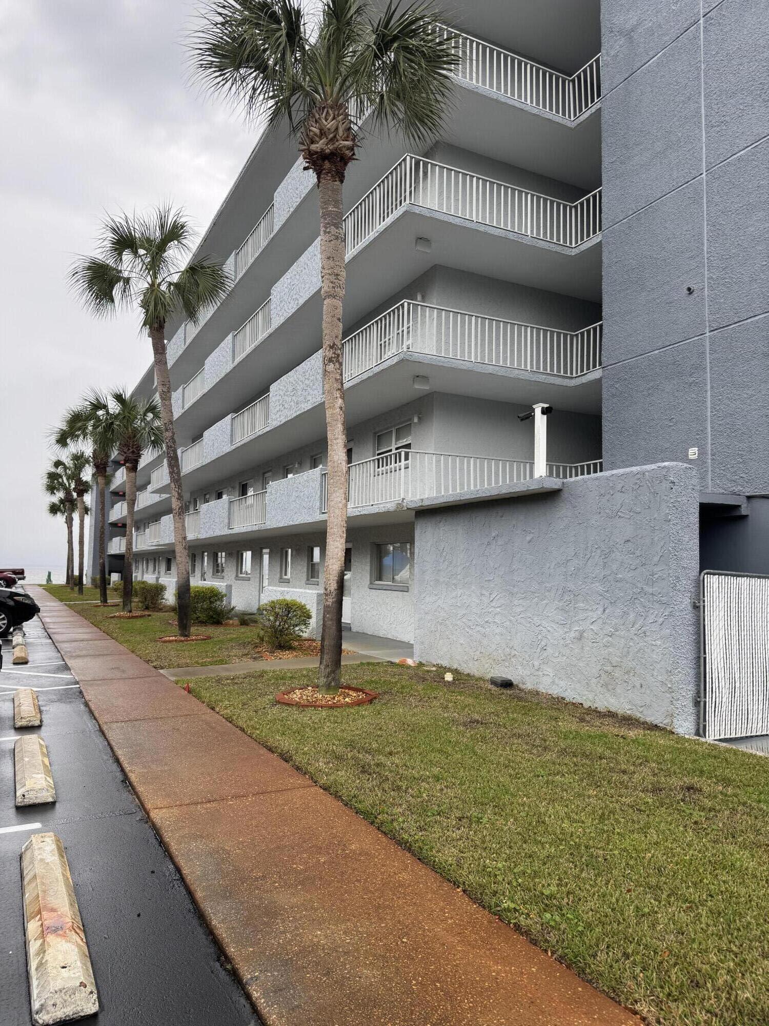 3857 Indian Trail, Unit 507 Destin, FL 32541 - Photo 33 of 33 a front view of a house with garden